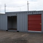 Storage Container with Three Roll Up Doors One Open