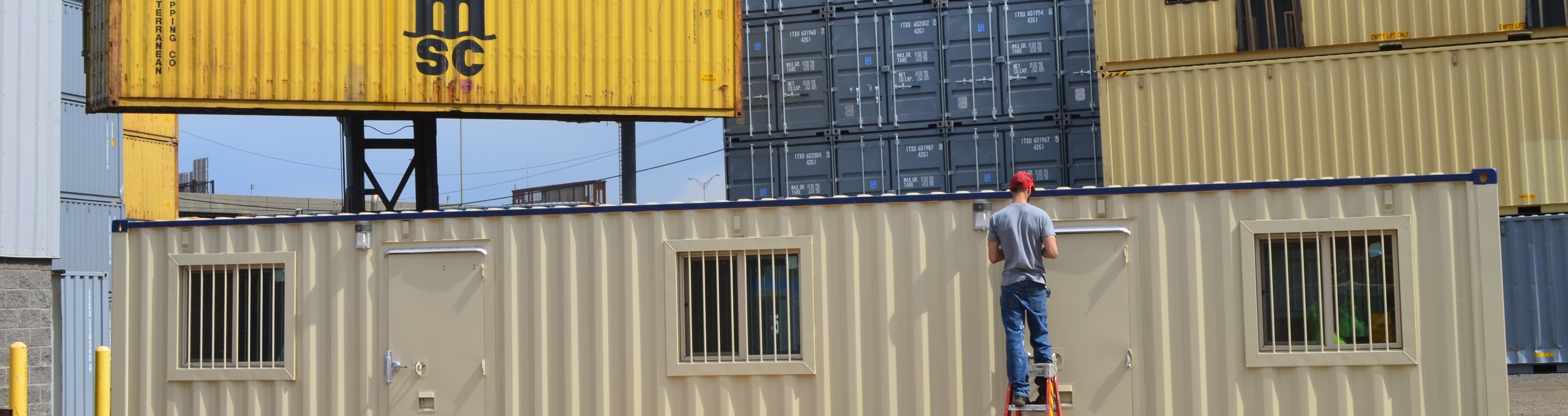 Exterior View of Shipping Container office with Security Bars on the Windows